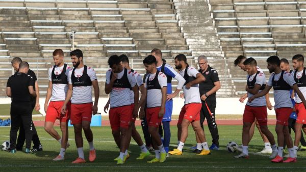 Tunisian players attend a training session on June 8, 2020 at the Elmanzeh stadium in Tunis, following 3 months of inactivity because of the Covid-19 pandemic crisis