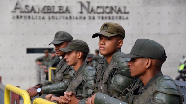 In this file photo taken on January 05, 2020, members of the Bolivarian National Guard stand guard outside of the National Assembly in Caracas. Venezuela will hold elections in December to renew the National Assembly, the only institution in opposition hands, the electoral authority announced on June 30, 2020. Yuri CORTEZ / AFP