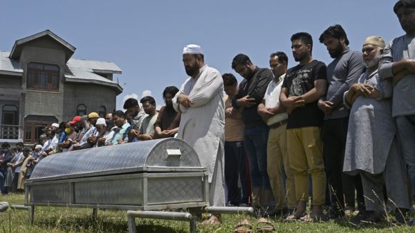 Relatives and neighbours offer funeral prayers for Bashir Ahmed, a civilian who died during a gun-battle between government forces and suspected militants, in Srinagar on July 1, 2020. TAUSEEF MUSTAFA / AFP