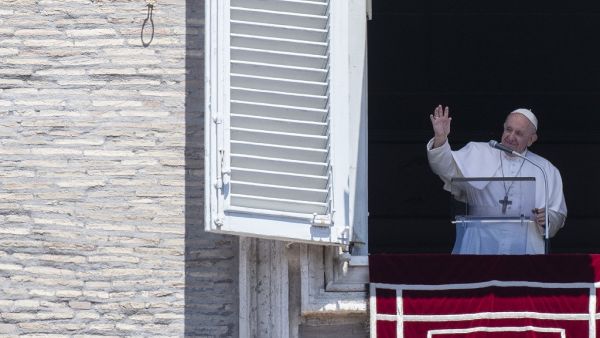 Pope Francis addresses the crowd from the window of the apostolic palace overlooking Saint Peter's square during his Sunday Angelus prayer on July 5, 2020. Tiziana FABI / AFP