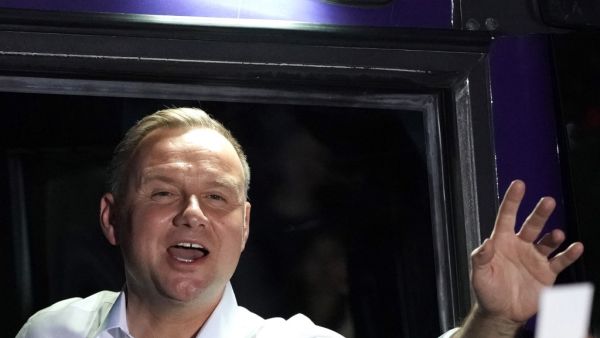 Polish president and candidate to his succession for the Law and Justice (PiS) party Andrzej Duda greets supporters during a campaign meeting ahead of the presidential election in Lomza, central Poland on July 7, 2020. JANEK SKARZYNSKI / AFP
