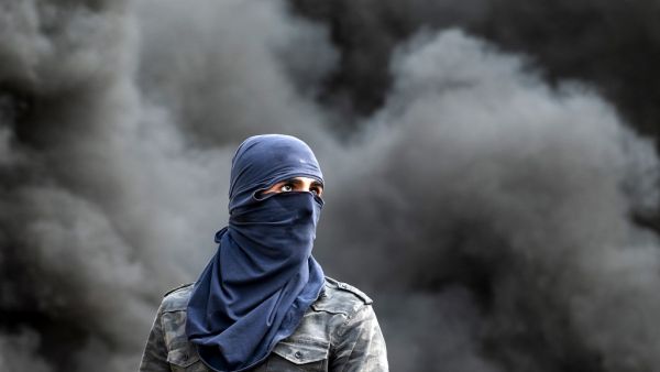 A Palestinian demonstrator is pictured during clashes following the funeral of 29-year-old Palestinian Ibrahim Abou Yacoub, who was killed by Israeli forces, in the village of Kifl Hares, south of the West Bank city of Nablus on July 10, 2020. JAAFAR ASHTIYEH / AFP