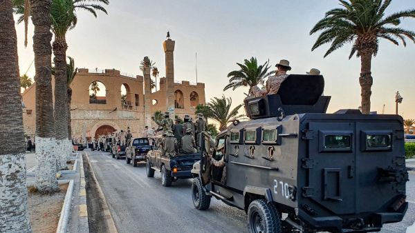 Vehicles of the "Tripoli Brigade", a militia loyal to the UN-recognised Government of National Accord (GNA), parade through the Martyrs' Square at the centre of the GNA-held Libyan capital Tripoli on July 10, 2020. Mahmud TURKIA / AFP
