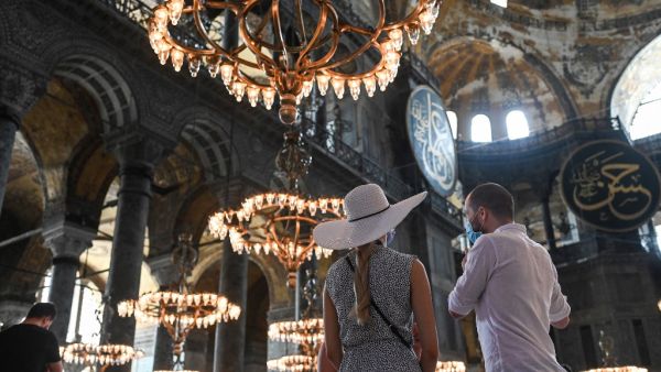 Tourists visit the inside of Hagia Sophia on July 10, 2020, in Istanbul, before a top Turkish court revoked the sixth-century Hagia Sophia's status as a museum, clearing the way for it to be turned back into a mosque. (AFP)
