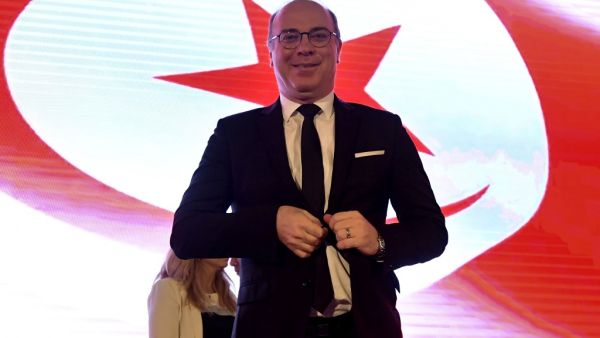 Tunisian Prime Minister Elyes Fakhfakh arrives to preside over the national conference "to establish decentralisation and local power" on July 15, 2020 in Tunis. The Islamist party Ennahdha has withdrawn its trust from the Fakhfakh government. The resignation of the head of government, Elyes Fakhfakh, or the continuation of his office at the head of the government depends on the results of the audit committee's investigation into the conflict of interest scandal, which will be published on Friday 17.  FETHI