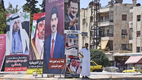 Campaign posters of candidates for the upcoming Syrian parliamentary election are displayed in the northern city of Aleppo, on July 15, 2020. AFP