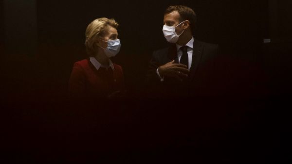 President of the European Commission Ursula von der Leyen (L) talks with France's President Emmanuel Macron prior the start of the EU summit at the European Council building in Brussels, on July 18, 2020, as the leaders of the European Union hold their first face-to-face summit over a post-virus economic rescue plan. The EU has been plunged into a historic economic crunch by the coronavirus crisis, and EU officials have drawn up plans for a huge stimulus package to lead their countries out of lockdown.  Fra