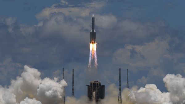 A Long March-5 rocket, carrying an orbiter, lander and rover as part of the Tianwen-1 mission to Mars, lifts off from the Wenchang Space Launch Centre in southern China's Hainan Province on July 23, 2020. Noel CELIS / AFP