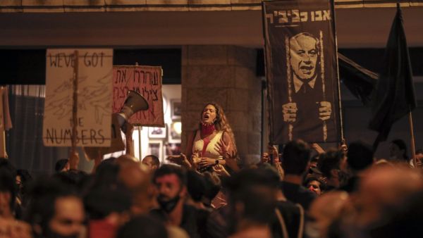 Protesters gather for a demonstration against the Israeli government near the Prime Minister's residence in Jerusalem on July 25, 2020. AHMAD GHARABLI / AFP