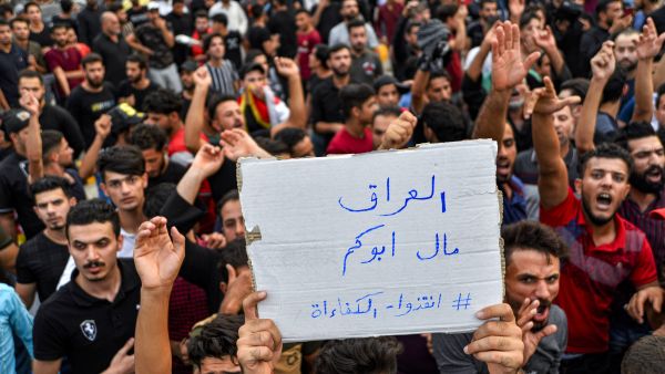 “Iraq doesn't belong to your father” - protesters chant slogans during a demonstration across Baghdad, Najaf and Nasiriyah. “We don't want this corrupt government," protesters have chanted. “All are corrupt equally!" (Haidar Hamdani/AFP)