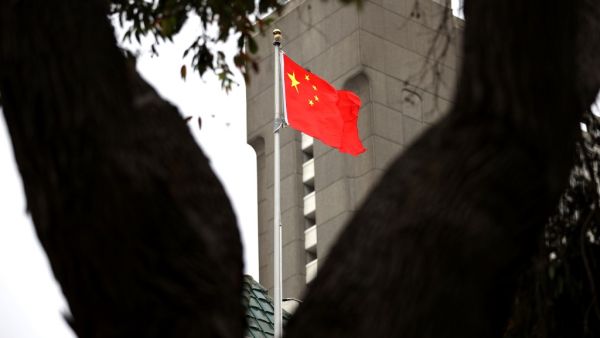 The Chinese flag flies over the Consulate General of China on July 24, 2020 in San Francisco, California. Juan Tang, a researcher at the University of California, Davis who took refuge in the Chinese consulate in San Francisco, was arrested for allegedly lying to investigators about her Chinese military service. Justin Sullivan/Getty Images/AFP