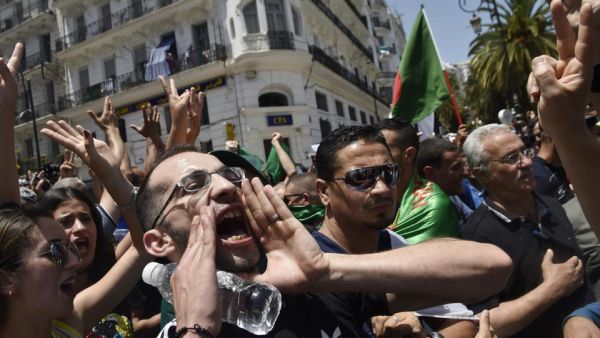 Algerian protesters shout anti-system slogans during the weekly Friday demonstration in the capital Algiers on June 21, 2019. (AFP)
