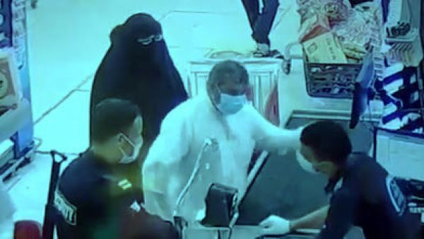 The attacker slapping a worker across the face at the Sabah Al-Ahmad cooperative supermarket. (Twitter/ Video Screenshot)