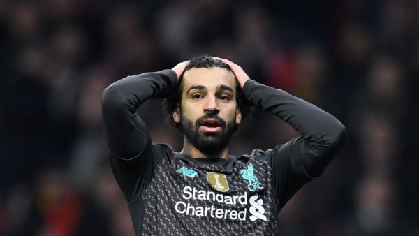The Egyptian forward says he just wants to "enjoy the moment" after adding the Premier League to his ever-growing haul of major trophies (Photo: AFP)