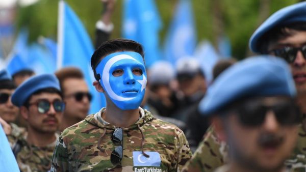 Ethnic Uighurs take part in a protest march in Brussels asking for the EU to call upon China to respect human rights (AFP/File photo)