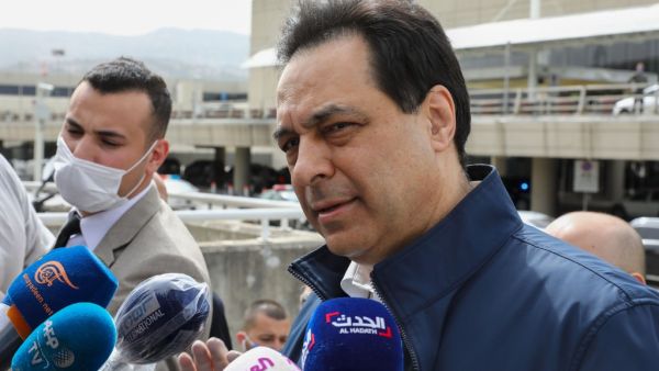 In this file photo taken on April 5, 2020 Lebanese Prime Minister Hassan Diab speaks to the media outside the Beirut international airport. Diab was expected to announce his government's resignation on August 10, 2020 amid popular outrage over the deadly Beirut port explosion that has reignited angry street protests. ANWAR AMRO / AFP