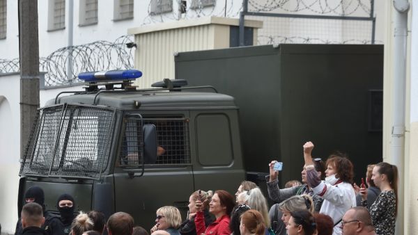 A police van drives out of a detention centre while allegedly transporting people who were jailed to different terms for participating in recent rallies of opposition supporters, who accuse strongman Alexander Lukashenko of falsifying the polls in the presidential election, in Minsk on August 12, 2020. Sergei GAPON / AFP