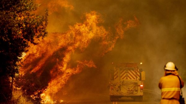Dozens of fires are burning out of control throughout Northern California as fire resources are spread thin. JOSH EDELSON / AFP