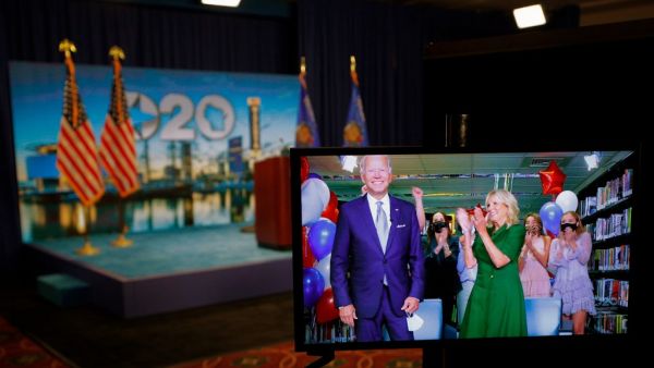 US Democratic presidential candidate and former Vice President Joe Biden (L) reacting next to wife Jill Biden after being formally nominated as the Democratic presidential candidate during the second day of the convention on a video feed at its hosting site in Milwaukee, Wisconsin, on August 18, 2020. BRIAN SNYDER / POOL / AFP
