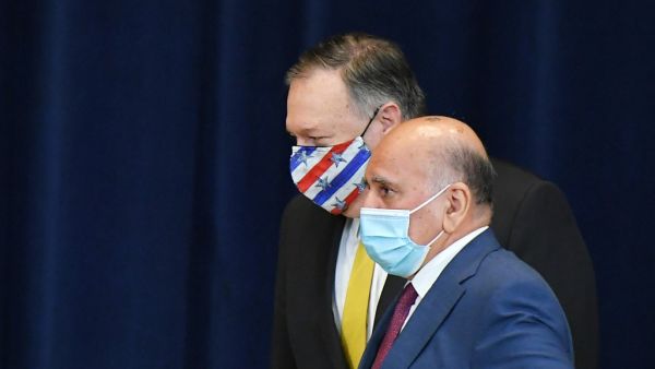 US Secretary of State Michael Pompeo(L) and Iraq's Foreign Minister Fuad Hussein arrive for a press conference at the State Department in Washington, DC on August 19, 2020. MANDEL NGAN / AFP