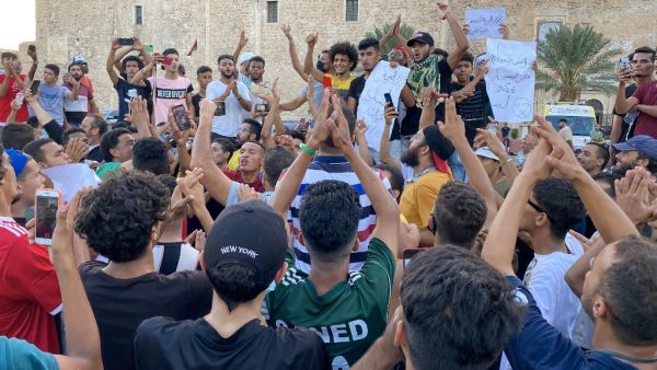 Libyans chant slogans during a demonstration due to poor public services at the Martyrs' Square at the centre of the GNA-held Libyan capital Tripoli on August 24, 2020. AFP