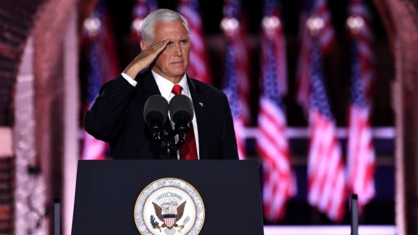 US Vice President Mike Pence salutes after speaking during the third night of the Republican National Convention at Fort McHenry National Monument in Baltimore, Maryland, August 26, 2020. SAUL LOEB / AFP