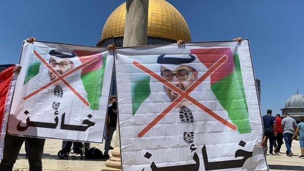 Palestinians protest at the Al Aqsa Mosque in Al Quds/Jerusalem again the Abu Dhabi Crown Prince and videos are shown defacing his image and the Emirates flag (Twitter)