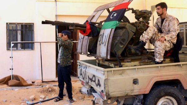 Libyan fighters loyal to GNA hold position near Salah al-Din military compound south of capital Tripoli earlier this month (AFP)