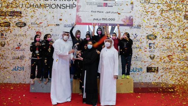Al Wahda Jiu-Jitsu Club with the overall championship trophy. -- Supplied photo