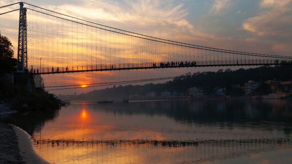 View of River Ganga and Ram Jhula bridge at sunset. Rishikesh. India  (Shutterstock)	
