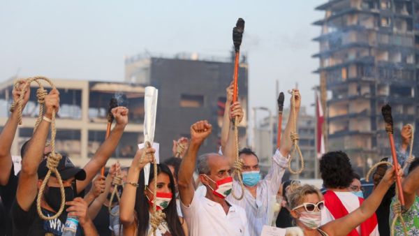 Lebanese demonstrators carry nooses and torches during a demonstration to mark one month since the cataclysmic August 4 explosion that killed 191 people, at Beirut's port area in the Lebanese capital Beirut on September 4, 2020. ANWAR AMRO / AFP