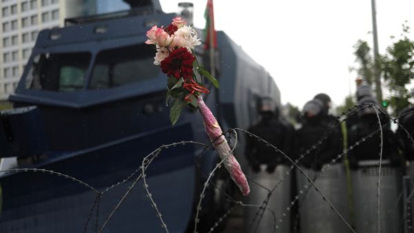 Flowers attached to a barbed wire fence during a rally to protest against the disputed August 9 presidential elections results in Minsk on September 6, 2020. Tens of thousands of Belarusians staged a peaceful new march on September 6, keeping the pressure on strongman Alexander Lukashenko who has refused to quit after his disputed re-election and turned to Russia for help to stay in power. TUT.BY / AFP