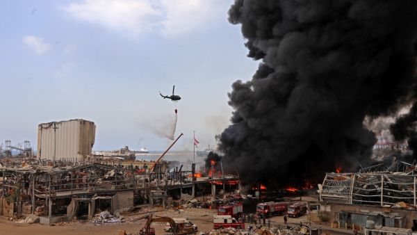 Lebanese firefighters try to put out a fire that broke out at Beirut's port area, on September 10, 2020. Thick black columns of smoke rose into the sky, as the army said it had engulfed a warehouse storing engine oil and vehicle tyres.  ANWAR AMRO / AFP