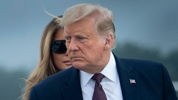 US President Donald Trump and First Lady Melania Trump board Air Force One at Joint Base Andrews in Maryland on September 11, 2020. President Trump and the First Lady travel to Shanksville, Pennsylvania, to attend the 19th anniversary commemoration for the 9/11 attacks. Brendan Smialowski / AFP