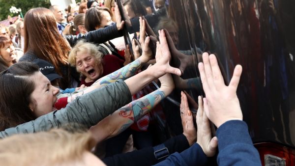 Women block a police bus during a rally to protest against the presidential election results in Minsk on September 12, 2020. Belarus strongman Alexander Lukashenko, 66, who has been in power for 26 years, has vowed that he will not give up power to the opposition, which claims its candidate Svetlana Tikhanovskaya was the rightful winner of the August 9 polls. TUT.BY / AFP
