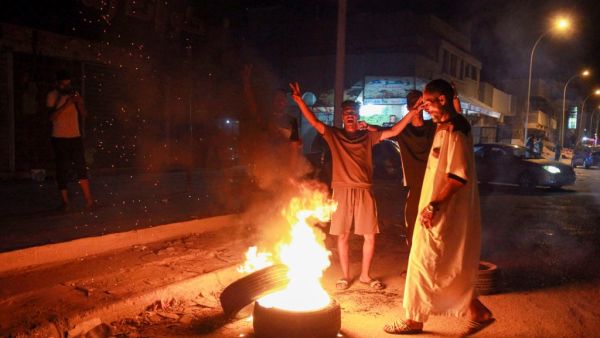 Libyan youth block a road with burning tyres in Libya's eastern coastal city of Benghazi on September 12, 2020, as they protest the poor public services and living conditions. Abdullah DOMA / AFP