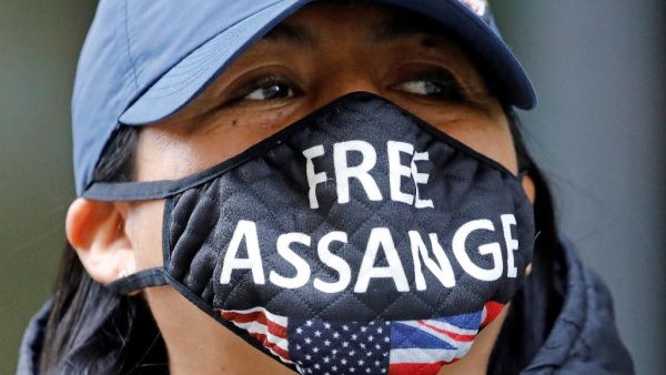 Demonstrators protest outside of the Old Bailey court in central London on September 14, 2020, where the extradition hearing against WikiLeaks founder Julian Assange has resumed. Assange is fighting to avoid extradition to the United States for leaking military secrets. If convicted, Assange -- who has been held at the high-security Belmarsh Prison for the last 16 months -- could be jailed for up to 175 years. Tolga AKMEN / AFP