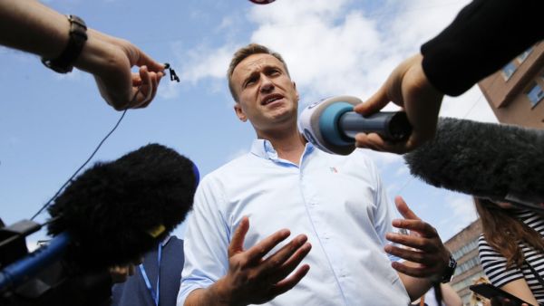 This file photo taken on July 20, 2019 in Moscow shows Russian opposition leader Alexei Navalny speaking with journalists during a rally to support opposition and independent candidates after authorities refused to register them for September 2019 elections to the Moscow City Duma. Maxim ZMEYEV / AFP