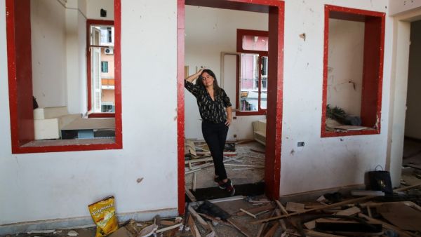 Lebanese entrepreneur Gizelle Hassoun stands amidst the rubble of the Madame Om pub, in the Lebanese capital's Gemmayze area on September 18, 2020. Nestled on the first floor of a blue villa in Beirut's lively Gemmayzeh district, Madame Om was once a popular night spot famed for its weekend parties and drag shows. But today the walls of the rented venue are cracked, part of its floor has caved in, and its balcony has been blown off. The pub is going to have to move. ANWAR AMRO / AFP