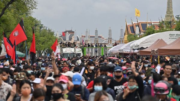 Anti-government protesters take part in a pro-democracy rally in Bangkok on September 20, 2020. Thousands of protesters cheered as activists installed a new plaque on September 20 declaring that Thailand "belongs to the people" -- the boldest show of defiance in a youth-led movement which has questioned the unassailable monarchy's role in the kingdom.  Lillian SUWANRUMPHA / AFP
