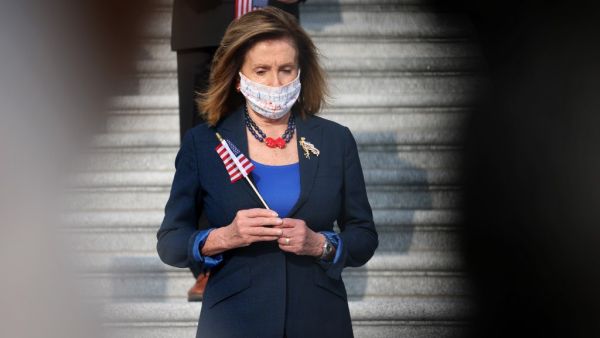 U.S. Speaker of the House Nancy Pelosi (D-CA), members of the House, staff and law enforcement members observe a moment of silence during an event on September 11, 2020 marking the anniversary of the September 11th terror attacks on the World Trade Center. (AFP)