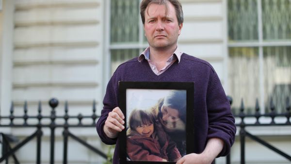 Richard Ratcliffe, husband of Nazanin Zaghari-Ratcliffe, a British-Iranian woman is in prison in Iran, with a photograph of his wife and daughter outside the Iranian Embassy in London this week. (Isabel Infantes / AFP - Getty Images)
