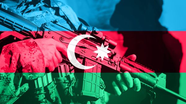 Soldier with machine gun with national flag of Azerbaijan  (Shutterstock)	