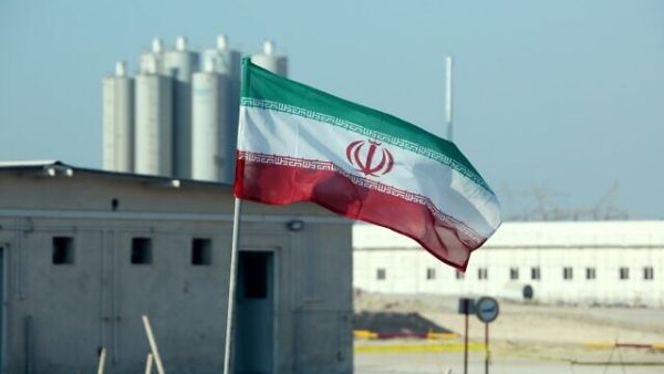 An Iranian flag flutters at Iran's Bushehr nuclear power plant on November 10, 2019. (Atta Kenare/AFP)