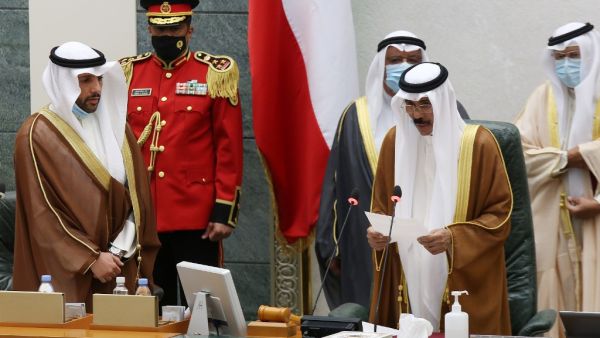 Sheikh Nawaf al-Ahmad Al-Sabah (2-R) reads a statement asfter being sworn in as Kuwait's new Emir at the National Assembly in Kuwait City, as Parilament Speaker Marzouq al-Ghanem (L) looks on, on September 30, 2020. Kuwait today swore in its new emir, Sheikh Nawaf al-Ahmad Al-Sabah, after the death of his half-brother, Sheikh Sabah, who died in the US at the age of 91. Yasser Al-Zayyat / AFP