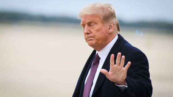An October 1, 2020 photo shows US President Donald Trump upon arrival at Andrews Air Force Base in Maryland on October 1, 2020 after he returned to Washington, DC following a fundraiser in Bedminster, New Jersey. MANDEL NGAN / AFP