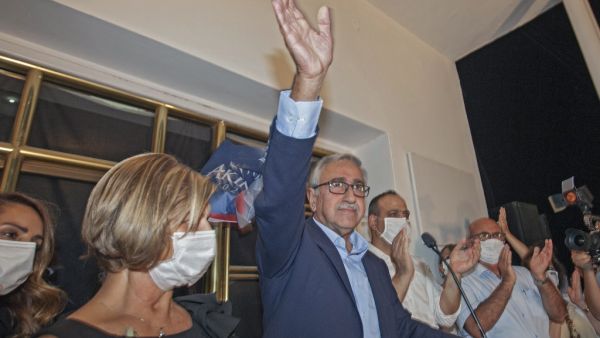 Turkish-Cypriot leader Mustafa Akinci delivers a speech as he celebrates with his supporters after reaching the second round of the Presidential elections in the northern part of Nicosia, the capital of the self-proclaimed Turkish Republic of Northern Cyprus (TRNC). Birol BEBEK / AFP