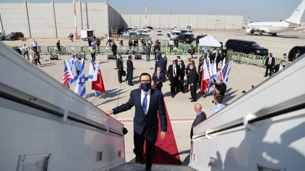 US Treasury Secretary Steve Mnuchin boards the El Al flight to Bahrain's capital Manama at Israel's Ben Gurion Airport near Tel Aviv on October 18, 2020, after the two states reached a US-brokered normalisation deal last month. RONEN ZVULUN / POOL / AFP