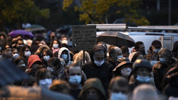 People attend the 'Marche Blanche' in Conflans-Sainte-Honorine, northwest of Paris, on October 20, 2020, in solidarity after a teacher was beheaded for showing pupils cartoons of the Prophet Mohammed. (AFP/File Photo)