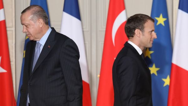 In this file photo taken on January 5, 2018 French President Emmanuel Macron (R) and Turkish President Recep Tayyip Erdogan walk during a joint press conference at the Elysee Palace in Paris. Turkish President Recep Tayyip Erdogan slammed on October 24, 2020 his French counterpart, Emmanuel Macron, over his policies toward Muslims, saying that he needed "mental checks." "What can one say about a head of state who treats millions of members from different faith groups this way: first of all, have mental chec